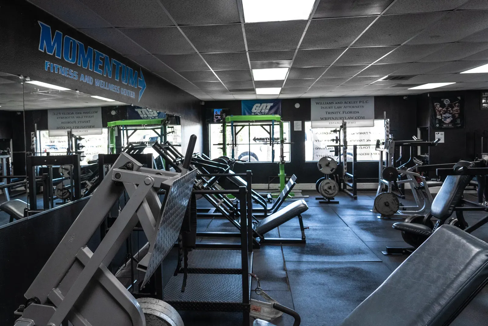 Eye-level view of an empty gym equipment area at night